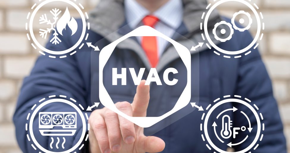 Businessman using virtual touchscreen presses abbreviation: HVAC